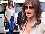 Please contact X17 before any use of these exclusive photos - x17@x17agency.com   EXCLUSIVE - Caitlyn Jenner is sexy in a cleavage-baring white top, skinny jeans and heels as she arrives for a visit with daughter Kendall Jenner. Jenner also sports a monogrammed "Caitlyn" necklace and looks like she has a sore on her right foot from all the fancy footwear she's been wearing. Monday, December 21, 2015. Castro/X17online.com