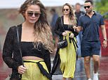 22.DEC.2015 - HAWAII\n*EXCLUSIVE ALL ROUND PICTURES - STRICTLY AVAILABLE FOR UK AND GERMANY USE ONLY*\nChrissy Teigen shows off her baby bump in a crop top and loose fitting yellow pants as her and John Legend go out to sushi while on their holiday vacation in Hawaii. \nBYLINE MUST READ : XPOSUREPHOTOS.COM\n***UK CLIENTS - PICTURES CONTAINING CHILDREN PLEASE PIXELATE FACE PRIOR TO PUBLICATION ***\n*UK CLIENTS MUST CALL PRIOR TO TV OR ONLINE USAGE PLEASE TELEPHONE 0208 344 2007*