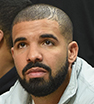 Drake cut a casual figure as he sat front row at the basketball