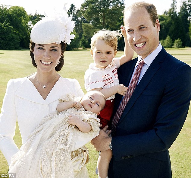 Fond memories: The first photograph on the Queen's desk was taken by celebrated fashion photographer Mario Testino to mark the christening of Princess Charlotte in July (pictured)