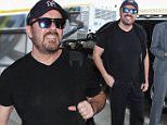 Picture Shows: Ricky Gervais  January 11, 2016\n \n Actor Ricky Gervais is seen departing on a flight at LAX airport in Los Angeles, California. Ricky was heading back to London after hosting last night's Golden Globe Awards. \n \n Non-Exclusive\n UK RIGHTS ONLY\n \n Pictures by : FameFlynet UK © 2016\n Tel : +44 (0)20 3551 5049\n Email : info@fameflynet.uk.com