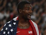 USA's Justin Gatlin (L) and Tyson Gay (R) talk at the end of the final of the men's 4x100 metres relay athletics event at the 2015 IAAF World Championships at the "Bird's Nest" National Stadium in Beijing on August 29, 2015. The US team was disqualified. AFP PHOTO / GREG BAKER        (Photo credit should read GREG BAKER/AFP/Getty Images)