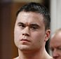 Daniel Holtzclaw, center, listens as Gayland Gieger, right, Oklahoma County assistant district attorney, speaks during Holtzclaw's sentencing hearing in Oklahoma City, Thursday, Jan. 21, 2016. At left is defense attorney Scott Adams. (AP Photo/Sue Ogrocki, Pool)