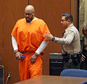 FILE - In this Oct. 27, 2015 file photo, former rap mogul Marion "Suge" Knight is led into court for his arraignment on robbery charges, in Los Angeles. Knight received a new attorney in a murder case Thursday, Jan. 21, 2016, after his former defense attorney Thomas Mesereau was relieved from the  case. (Frederick M. Brown/Pool via AP, File)