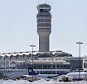 Snow removal is underway on the tarmac at  Ronald Reagan National Airport, Sunday, Jan. 24, 2016 in Arlington, Va. Millions of Americans began digging out Sunday from a mammoth blizzard that set a new single-day snowfall record in Washington and New York City.  (AP Photo/Alex Brandon)