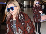Actress Abigail Breslin was at LAX, boldly wearing a Native American designed sweater, and blue reflective sunglasses, over black tights and knee-high leather boots, with a patriotic t-shirt.  Friday, January 22, 2016  X17online.com\\nOK FOR WEB SITE AT 20PP\\nMAGAZINES NORMAL FEES\\nAny queries please call Lynne or Gary on office 0034 966 713 949 \\nGary mobile 0034 686 421 720 \\nLynne mobile 0034 611 100 011\\nAlasdair mobile  0034 630 576 519