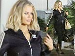 January 25, 2016 - Khloe Kardashian leaving the studio wearing Adidas warm up jacket and slippers after filming for the day.