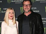 Arrivals to the Monster Energy Supercross at the Angel Stadium of Anaheim....Pictured: Tori Spelling, Dean McDermott..Ref: SPL1214417  230116  ..Picture by: @Parisa....Splash News and Pictures..Los Angeles: 310-821-2666..New York: 212-619-2666..London: 870-934-2666..photodesk@splashnews.com..