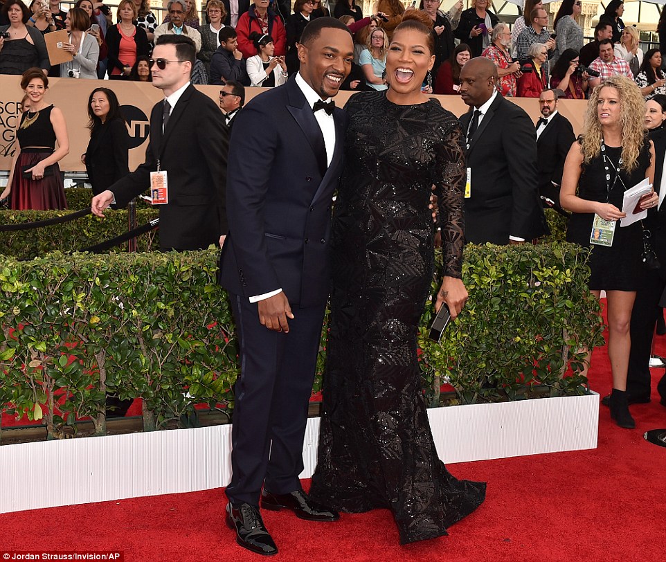 A winning look: Queen Latifah (wearing Michael Costello) won Best Actress in a TV Movie or Miniseries for HBO's Bessie, and posed on the red carpet with Anthony Mackie