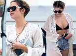 January 29, 2016: Pretty Little Liars actress Ashley Benson wears a black bikini top and jean shorts while relaxing by the pool with friends on a chilly day in Miami.\nMandatory Credit: INFphoto.com Ref: infusmi-11/13