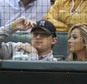 In this file photo made Tuesday, April 14, 2015, Johnny Manziel, left, sits with  Colleen Crowley during a baseball game between the Los Angeles Angels and the Texas Rangers in Arlington, Texas. Dallas police announced Friday, Feb. 5, 2016,  they were launching a criminal investigation into a domestic violence assault complaint filed against Manziel, who was involved in an altercation last weekend during which he allegedly struck his ex-girlfriend, Colleen Crowley, several times. (AP Photo/LM Otero)