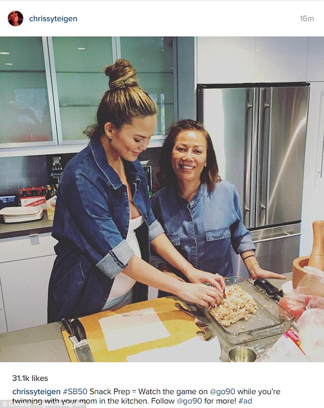 Bonding time: Chrissy shared a snap of herself making snacks for the gathering as her mother Vilailuck posed alongside her