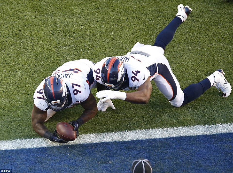 Denver Broncos defensive end Malik Jackson dived on the loose ball, taking it home for a touchdown after Cam Newton was sacked