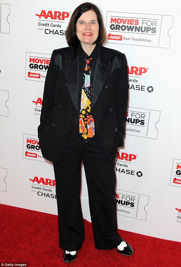 Suit up: Paula Poundstone suited up in a black suit with satiny lapels and black shirt brightened by a wildly printed tie