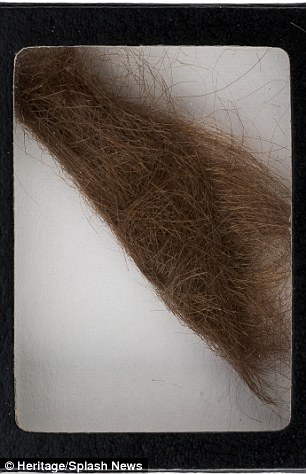 The hair was collected by a German hairdresser, who cut the former Beatles' hair. Also on offer is a call sheet signed by Lennon, right