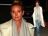 Heidi Klum goes casual for flight out of LA, rocking jeans and a long white jacket, with her hair pulled back, on Tuesday, February 9, 2016  X17online.com