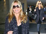 February 11, 2016: Heidi Klum touches down at LAX airport in Los Angeles, California. Mandatory Credit: PapJuice/INFphoto.com Ref: infusny-286