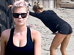 28.Feb.2016 - Malibu - USA\n**EXCLUSIVE ALL ROUND PICTURES**\n*** STRICTLY AVAILABLE FOR UK AND GERMANY USE ONLY ***\nModel, Charlotte McKinney, works on her pert derriere on Malibu beach.  The model made famous by 'Carl's Jr' commercials looked to be in amazing shape as she stretched and did various exercise poses to keep her cellulite-free body in tip top shape.  She was seen in a low-cut tank top, black micro shorts, Nike trainers, black sweater, and black sunglasses.\nBYLINE MUST READ : AKM-GSI-XPOSURE\n***UK CLIENTS - PICTURES CONTAINING CHILDREN PLEASE PIXELATE FACE PRIOR TO PUBLICATION ***\n*UK CLIENTS MUST CALL PRIOR TO TV OR ONLINE USAGE PLEASE TELEPHONE 0208 344 2007*\n