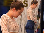 EXCLUSIVE: Miley Cyrus shops for clothes in Soho, visiting a few boutique shops, trying on various clothes including a fishnet top, through which her nipples were visible. She happily checked herself out in the mirror.\n\nPictured: Miley Cyrus\nRef: SPL1235558  290216   EXCLUSIVE\nPicture by: 247PAPS.TV / Splash News\n\nSplash News and Pictures\nLos Angeles: 310-821-2666\nNew York: 212-619-2666\nLondon: 870-934-2666\nphotodesk@splashnews.com\n