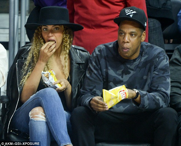 Date night: Beyonce and Jay Z munched on some chips as they enjoyed an NBA match between the Oklahoma City Thunder and home team Los Angeles Clippers on Wednesday