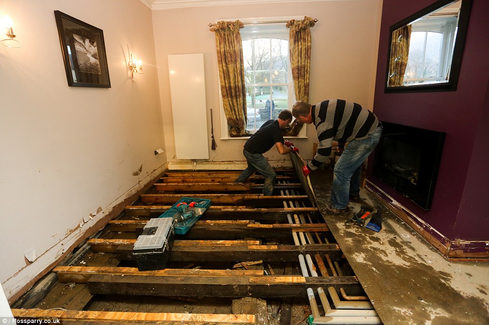 Some of the damage to a property in Keswick in Cumbria is pictured. The home was devastated by flood waters at the weekend