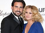 LOS ANGELES, CA - MARCH 02:  Singers Paulina Rubio (R) and Gerardo Bazua attend the 22nd Annual Elton John AIDS Foundation's Oscar Viewing Party on March 2, 2014 in Los Angeles, California.  (Photo by Frederick M. Brown/Getty Images)
