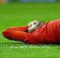 Emre Can of Liverpool feels the pain from a knock after an off the ball challenge with Marouane Fellaini during the UEFA Europa League Round of 16 First Leg match between Liverpool and Manchester United played at Anfield Stadium, Liverpool on March 10th 2016