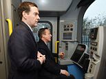 Prime Minister David Cameron (right) test drives a new sub-surface District line tube train, as Chancellor George Osborne looks on, at the Bombardier Transportation site in Derby, where Mr Osborne announced £5.2 billion investment in road and rail projects in the Midlands as part of a plan he said could create 300,000 new jobs in the region by 2020. 
Improvements could include the electrification of rail lines linking Birmingham to Bristol and Derby, as well as the widening of sections of the M1 and M5 motorways.

PRESS ASSOCIATION Photo. Picture date: Thursday February 12, 2015.
 See PA story POLITICS Midlands. Photo credit should read: Joe Giddens/PA Wire