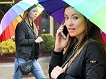 EXCLUSIVE TO INF.\nMarch 14, 2016: A make up-less Olivia Wilde beats the rain with a rainbow umbrella today in New York City.\nMandatory Credit: Matthew Nelson/INFphoto.com Ref: infusny-293