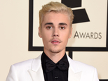 FILE - In this Feb. 15, 2016 file photo, Justin Bieber arrives at the 58th annual Grammy Awards in Los Angeles. An attorney for a photographer who sued Bieber claiming he suffered lasting injuries from a 2012 attack at a shopping plaza in Calabasas, Calif., said Wednesday, March 16, 2016 that the case has been resolved but he could not comment further. (Photo by Jordan Strauss/Invision/AP, FIle)