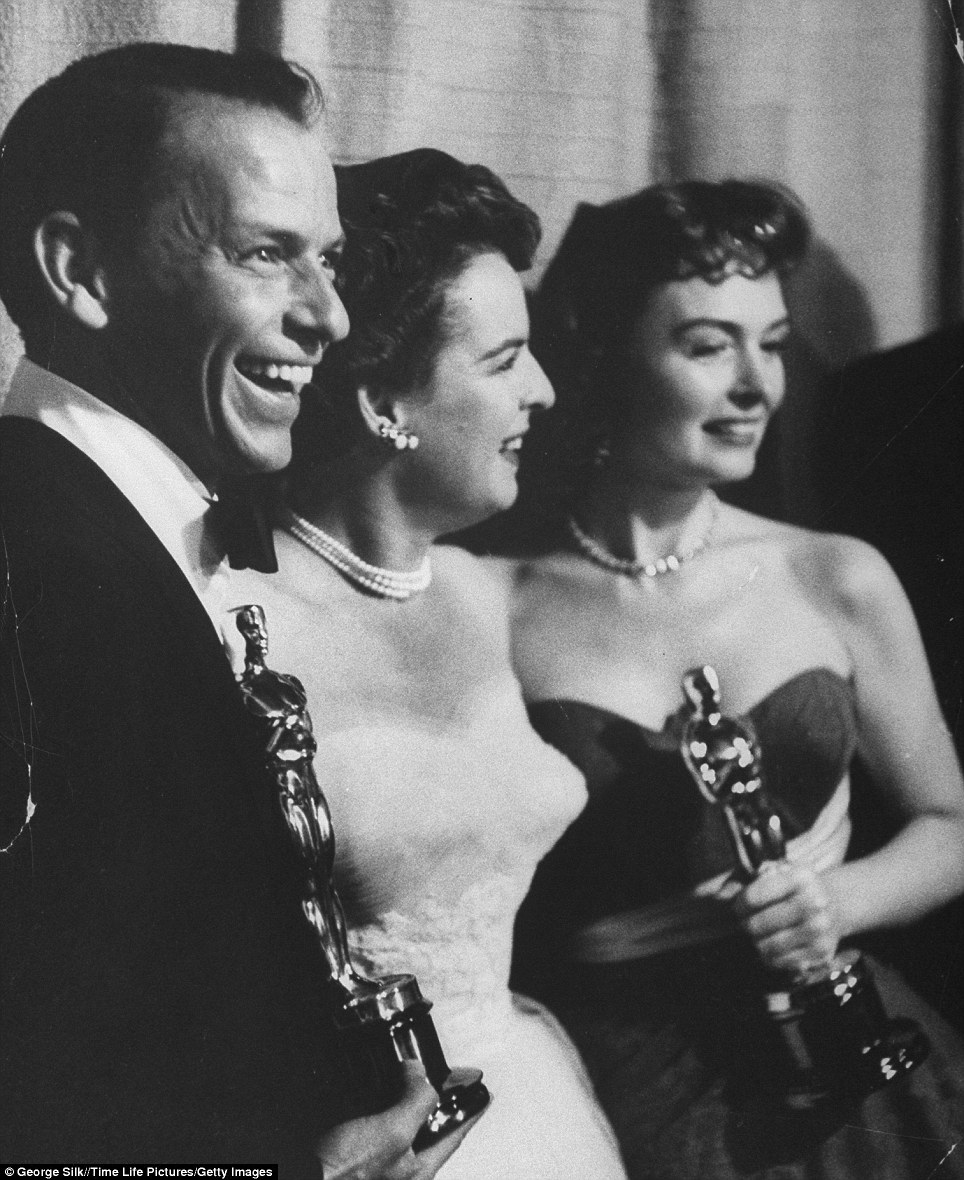 The best is yet to come: Frank Sinatra and Donna Reed (pictured right) hold their best supporting Oscars while posing with presenter Mercedes McCambridge (centre) for the movie From Here to Eternity at the 26th Annual Academy Awards Ceremony