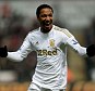 Pearler: Jonathan de Guzman celebrates after bending in a free kick for his first of the afternoon