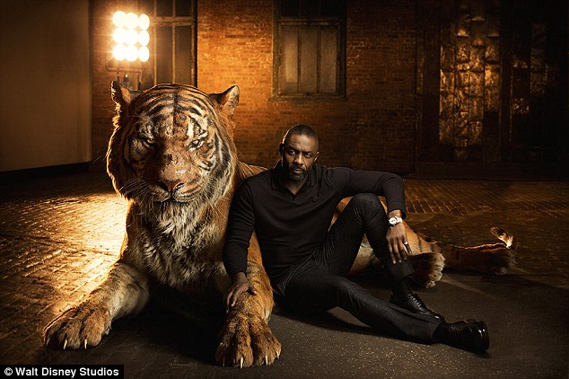 Not to be trifled with: Idris Elba looked relaxed for a man leaning up against a giant, Bengal tiger, though of course the CGI image represented his character Shere Khan, who 'reigns with fear' and has it out for Mowgli due to his 'hatred of humans'