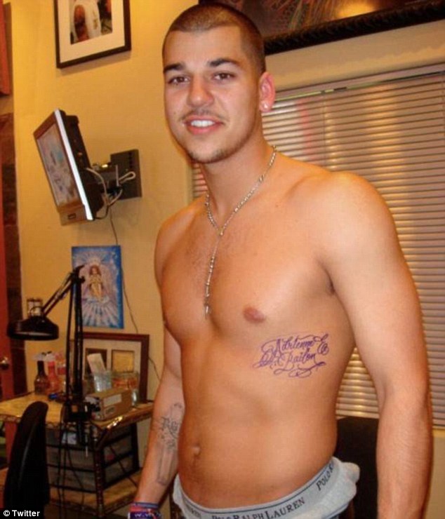 Young love: During their relationship Rob got a tattoo of Adrienne's name on his torso