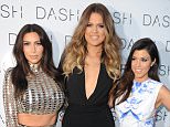MIAMI BEACH, FL - MARCH 12: Kim Kardashian, Khloe Kardashian and Kourtney Kardashian attend the Grand Opening of DASH Miami Beach at Dash Miami Beach on March 12, 2014 in Miami Beach, Florida. (Photo by Larry Marano/WireImage)