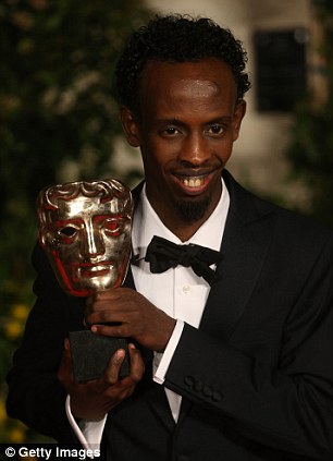 He's pleased: Barkhad Abdi has plenty to smile about following his win on Sunday evening