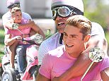 *PREMIUM EXCLUSIVE* **MUST CALL FOR PRICING** Savannah, GA - Zac Efron and Dwayne Johnson have a busy but fun morning on the set of their next movie 'Baywatch' while filming a scene on top of a pink scooter wearing matching tees and funny helmets!\nCREDIT MUST READ: FameFlynet/AKM-GSI\nAKM-GSI      March 21, 2016\nTo License These Photos, Please Contact :\nSteve Ginsburg\n(310) 505-8447\n(323) 423-9397\nsteve@akmgsi.com\nsales@akmgsi.com\nor\nMaria Buda\n(917) 242-1505\nmbuda@akmgsi.com\nginsburgspalyinc@gmail.com