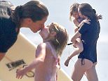 03/21/2016\nPREMIUM EXCLUSIVE: Gisele B¸ndchen continues her third day of a surfing vacation with husband Tom Brady as they hit the beach in Costa Rica. Gisele first took the time for a private lesson with a surf coach where she allowed her daughter to come down to the beach and watch. After the lesson the 35 year old mother of two took to the ocean with board in hand, later joined by husband Tom Brady. The mother of two wrapped up the day by greeting her adorable daughter on the beach where she leaned in and gave the young girl a kiss.  \nPlease byline:TheImageDirect.com\n*EXCLUSIVE PLEASE EMAIL sales@theimagedirect.com FOR FEES BEFORE USE\n
