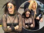 Please contact X17 before any use of these exclusive photos - x17@x17agency.com   Kendall Jenner wears a sexy sheer top as she leaves Justin Bieber's concert with blonde-haired sister Kylie. The concert was held at Staples Center in downtown Los Angeles. March 23, 2016 X17online.com PREMIUM EXCLUSIVE