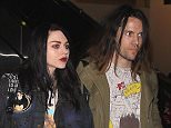 UK CLIENTS MUST CREDIT: AKM-GSI ONLY..Frances Bean Cobain and her fiancé Isaiah Silva make their way through LAX after their return home from the Sundance Film Festival.  The 22-year-old daughter of Kurt Cobain reunited with her mom Courtney Love, for the first time in five years, at the premiere of 'Kurt Cobain: Montage of Heck'.....Pictured: Frances Bean Cobain, Isaiah Silva..Ref: SPL936907  260115  ..Picture by: AKM-GSI / Splash News....