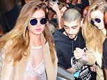 Zayn Malik and GF Gigi Hadid were spotted leaving her NYC Apartment on Friday afternoon. They headed to his live performance at Iheart Radio. They were swarmed by almost 100 fans as they left the Soho building. He protected her with his arm, as they walked through the crowd. She looked stunning in a almost completely sheer white top, and cream duster coat.\n\nPictured: Zayn Malik, Gigi Hadid\nRef: SPL1252553  250316  \nPicture by: 247PAPS.TV / Splash News\n\nSplash News and Pictures\nLos Angeles: 310-821-2666\nNew York: 212-619-2666\nLondon: 870-934-2666\nphotodesk@splashnews.com\n