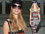 Los Angeles, CA - Paris Hilton looks absolutely stunning as she arrives at LAX dressed in a striped maxi dress and cross body bag. \nAKM-GSI      March 25, 2016\nTo License These Photos, Please Contact :\nSteve Ginsburg\n(310) 505-8447\n(323) 423-9397\nsteve@akmgsi.com\nsales@akmgsi.com\nor\nMaria Buda\n(917) 242-1505\nmbuda@akmgsi.com\nginsburgspalyinc@gmail.com