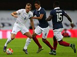 WEMBLEY, ENGLAND - NOVEMBER 17:  Harry Kane of England battles with Raphael Varane and Bacary Sagna of France during the international friendly between England and France at Wembley Stadium on November 17, 2015 in London, England.  (Photo by Catherine Ivill - AMA/Getty Images)