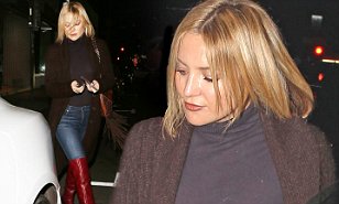 Kate Hudson puts on a leggy display in thigh-high scarlet boots and skintight jeans