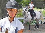 Picture Shows: Iggy Azalea  March 30, 2016\n \n Singer Iggy Azalea goes horseback riding in Los Angeles. Iggy recently released her new single 'Team'.\n \n Non-Exclusive\n UK RIGHTS ONLY\n \n Pictures by : FameFlynet UK © 2016\n Tel : +44 (0)20 3551 5049\n Email : info@fameflynet.uk.com