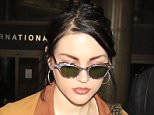 Frances Bean Cobain seen for the first time since news broke she's reportedly getting a divorce in an attempt to protect her later father's $450 million fortune.  The daughter of former Nirvana singer, Kurt Cobain was seen arriving into LAX with a fashion statement ring on her left hand.

Pictured: Frances Bean Cobain
Ref: SPL1252552  250316  
Picture by: Sharky / Splash News

Splash News and Pictures
Los Angeles: 310-821-2666
New York: 212-619-2666
London: 870-934-2666
photodesk@splashnews.com