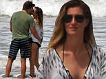 03/27/2016\nPREMIUM EXCLUSIVE Tom and Gisele wrap up their vacation in Costa Rica with a kiss on the beach! After spending the day with family the couple returned to the beach for a moment of quality time together. The couple seemed to be enjoying their time together in the very picturesque setting.\nPlease byline:TheImageDirect.com\n*EXCLUSIVE PLEASE EMAIL sales@theimagedirect.com FOR FEES BEFORE USE