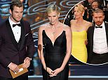HOLLYWOOD, CA - MARCH 02:  Actors Chris Hemsworth (L) and Charlize Theron speak onstage during the Oscars at the Dolby Theatre on March 2, 2014 in Hollywood, California.  (Photo by Kevin Winter/Getty Images)