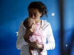 DENPASAR, BALI, INDONESIA - APRIL 21:  Heather Mack, 19, of the United States holds her baby daughter in a cell as she await her verdict hearing on April 21, 2015 in Denpasar, Bali, Indonesia. An Indonesian judge has sentenced Heather Mack to 10 years and her boyfriend Tommy Schaefer to 18 years in jail after they were found guilty of murdering Mack's mother, Sheila von Wiese-Mack, whose body was found stuffed inside a suitcase in the back of a taxi outside a luxury Bali hotel in August 2014. (Photo by Agung Parameswara/Getty Images)
