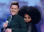 Trent Harmon, left, and LaíPorsha Renae appear at the "American Idol" farewell season finale at the Dolby Theatre on Thursday, April 7, 2016, in Los Angeles. (Photo by Matt Sayles/Invision/AP)